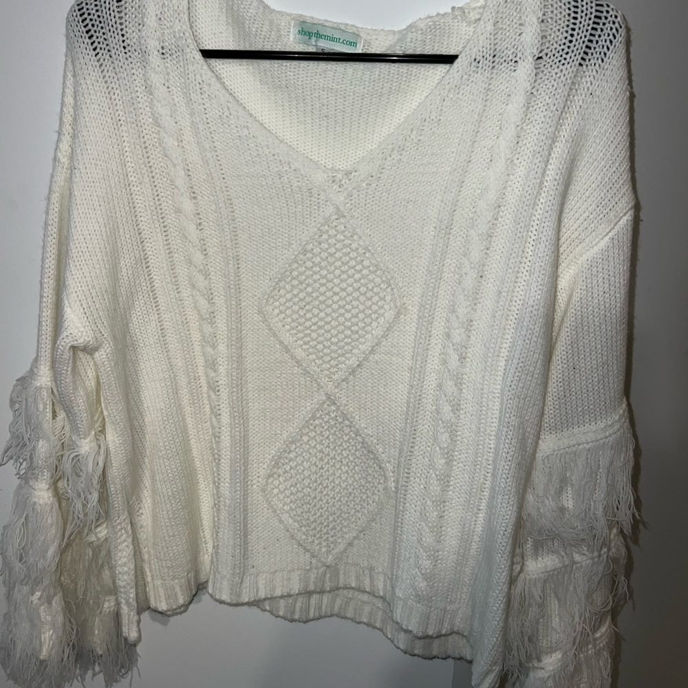 Boutique sweater with fringe sleeves